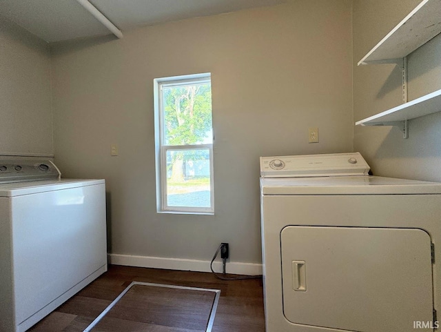 laundry room with laundry area, baseboards, dark wood-style floors, and separate washer and dryer