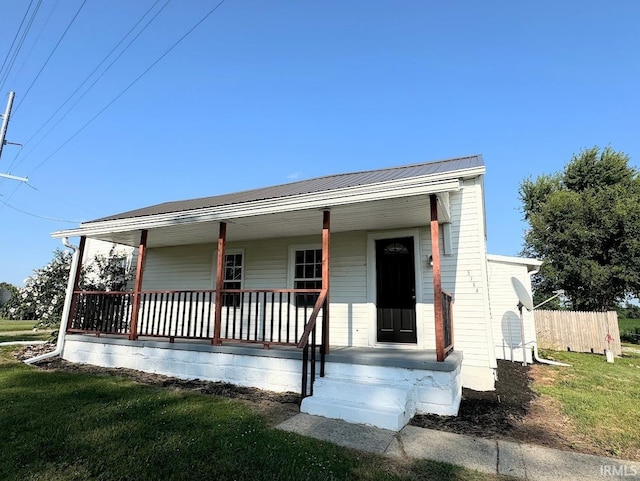 view of front of property with a porch and metal roof