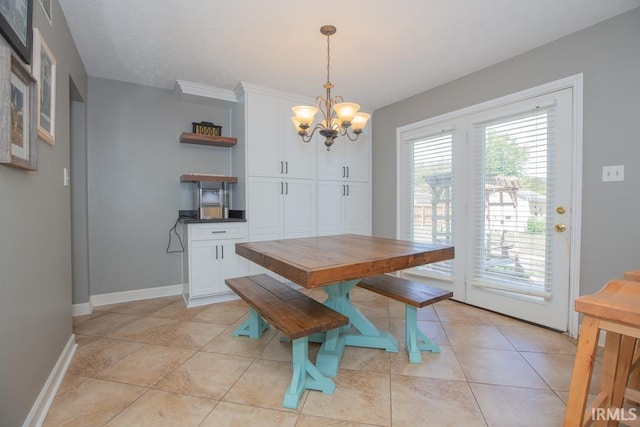 dining area featuring a notable chandelier and light tile patterned flooring