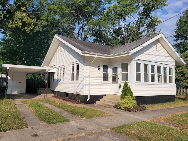 view of front of house with a carport