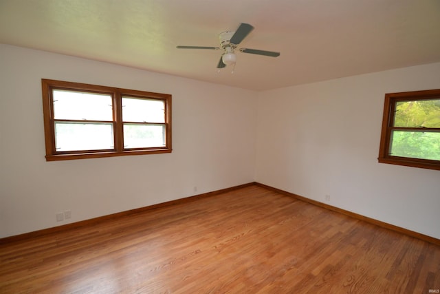 spare room featuring hardwood / wood-style flooring and ceiling fan