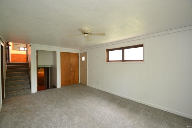 interior space with ceiling fan