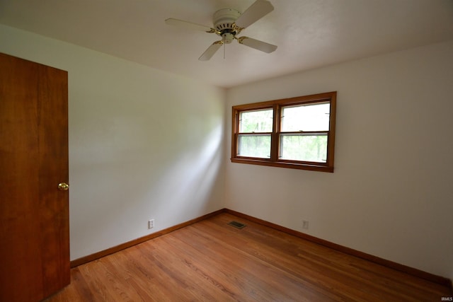 unfurnished room with light hardwood / wood-style flooring and ceiling fan