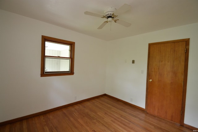 empty room with light hardwood / wood-style flooring and ceiling fan