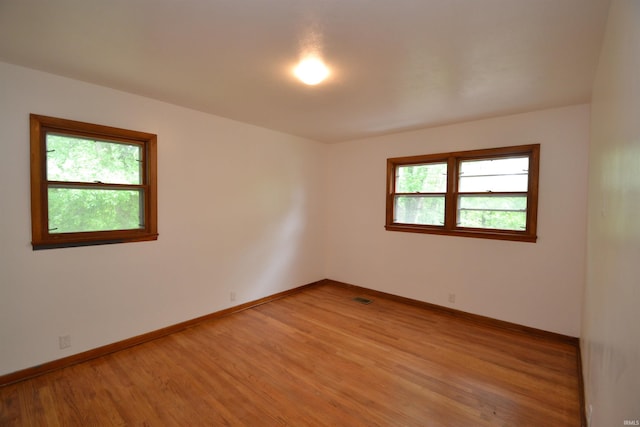 unfurnished room featuring light hardwood / wood-style floors