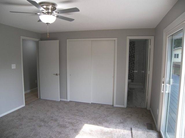 unfurnished bedroom featuring visible vents, ceiling fan, ensuite bathroom, carpet flooring, and a closet