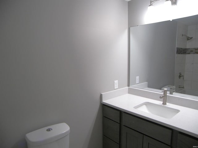 full bathroom with shower / bathtub combination, vanity, and toilet