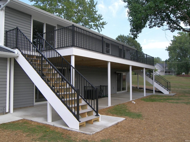 back of house featuring a patio, stairway, and a wooden deck