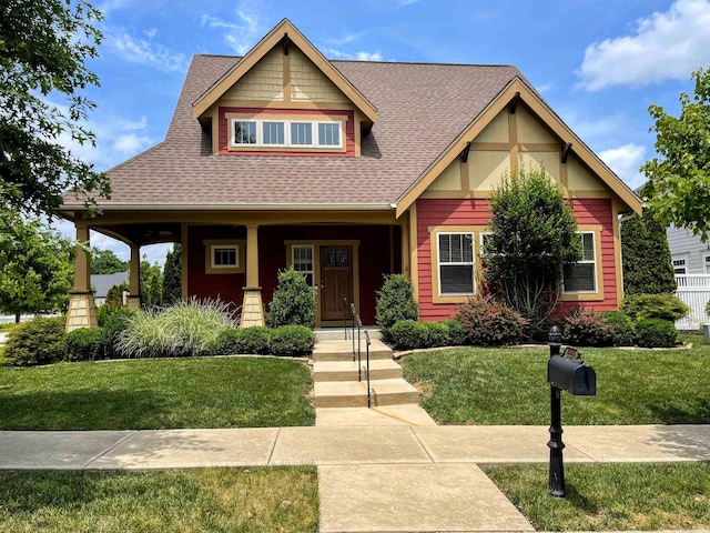 view of front of property with a front yard and a porch