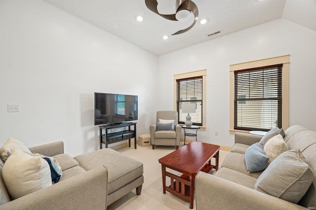 carpeted living room with lofted ceiling