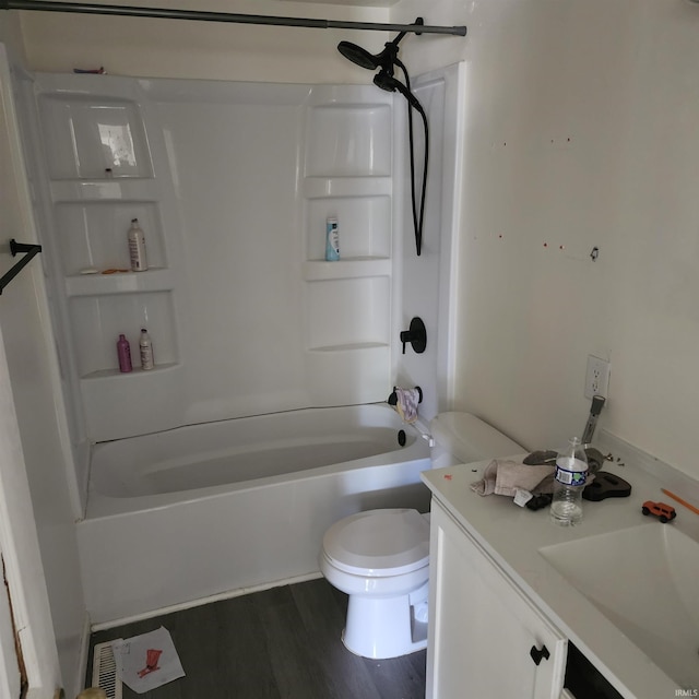 full bathroom with shower / bath combination, toilet, hardwood / wood-style flooring, and vanity