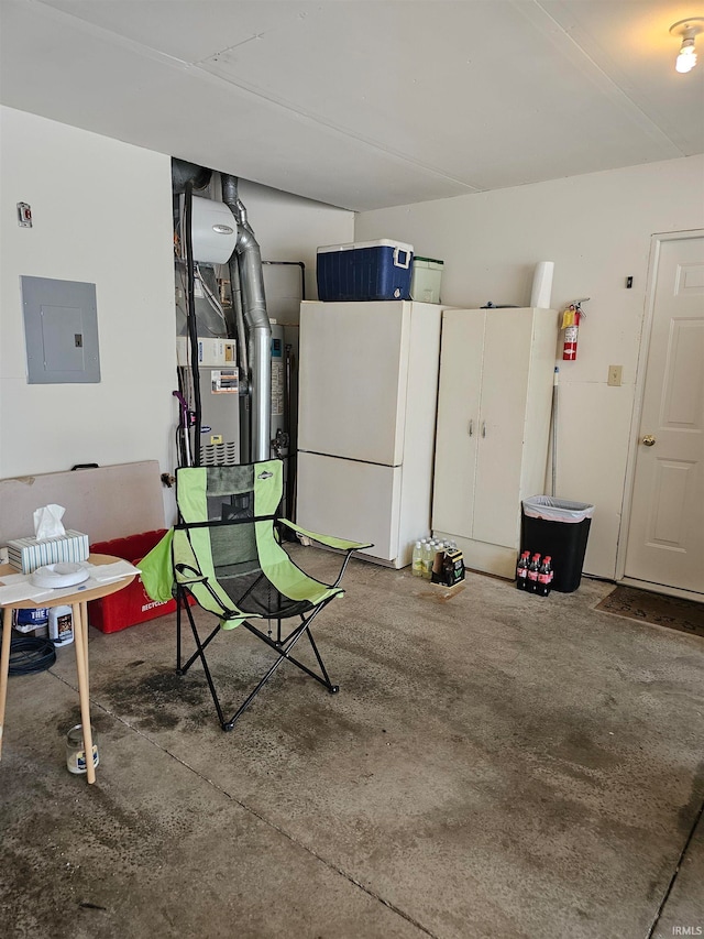 garage with electric panel and white fridge