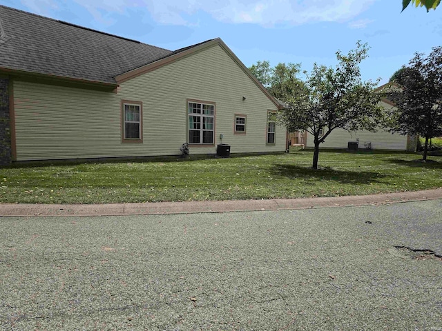 view of home's exterior featuring a yard