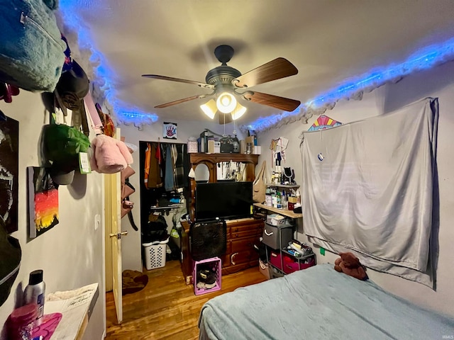 bedroom featuring hardwood / wood-style floors and ceiling fan