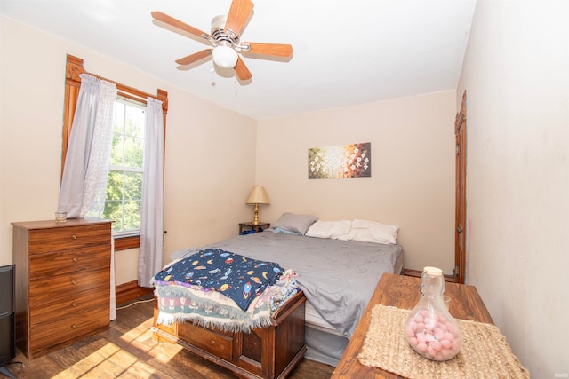 bedroom with ceiling fan and hardwood / wood-style flooring