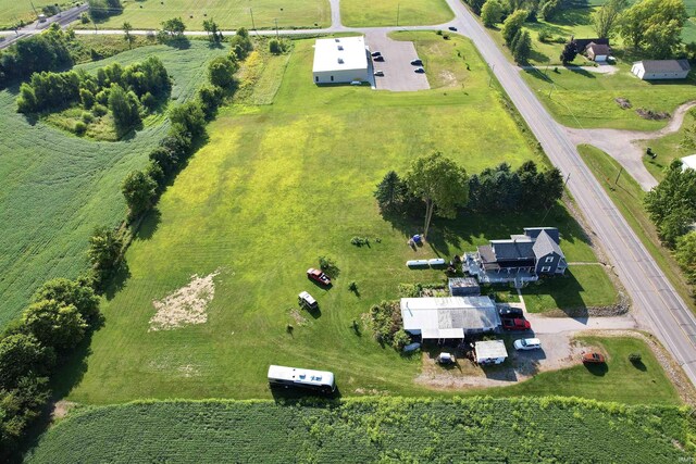 birds eye view of property with a rural view