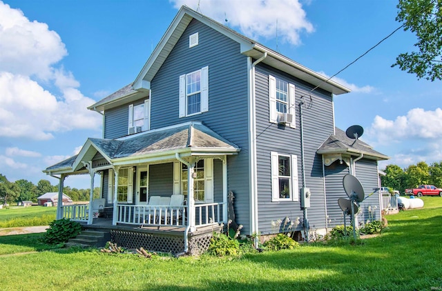 view of front of house with a front lawn and covered porch