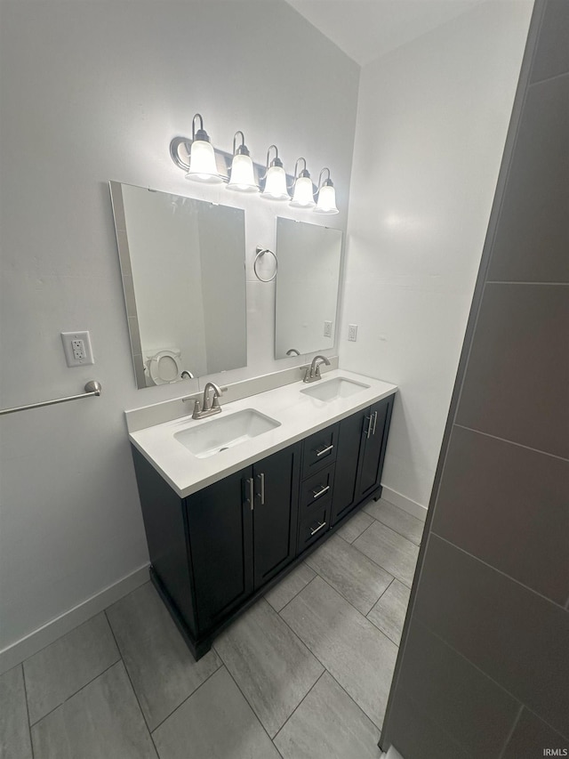 bathroom with vanity and tile patterned floors