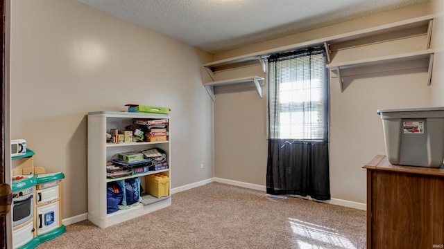interior space featuring baseboards and a textured ceiling