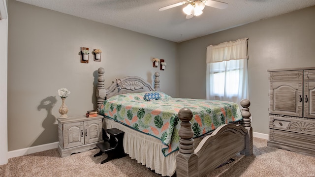 bedroom with light carpet, a textured ceiling, and baseboards