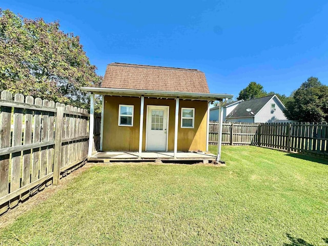 view of outbuilding with a yard