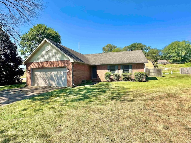 single story home featuring a front yard and a garage