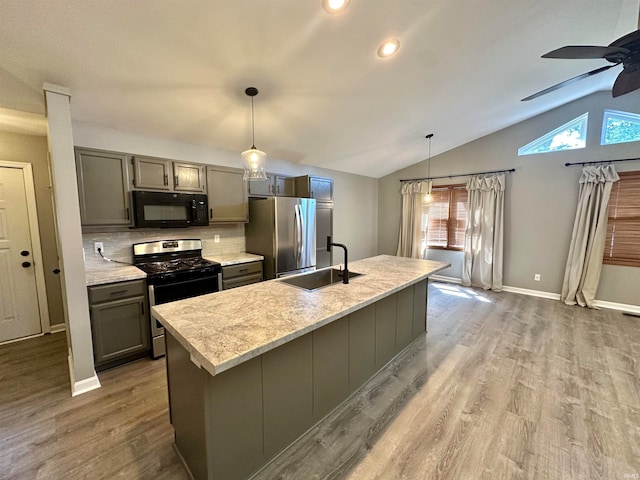 kitchen with ceiling fan, a wealth of natural light, stainless steel appliances, and sink