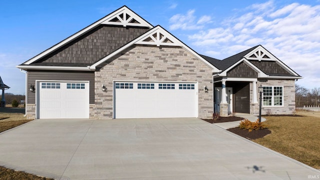 craftsman inspired home featuring a front yard and a garage