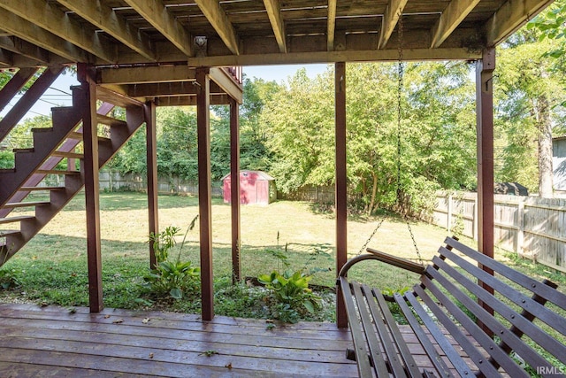 exterior space with a wooden deck and a shed