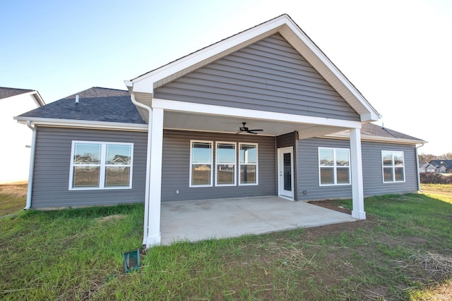 rear view of house with a patio, a yard, and ceiling fan