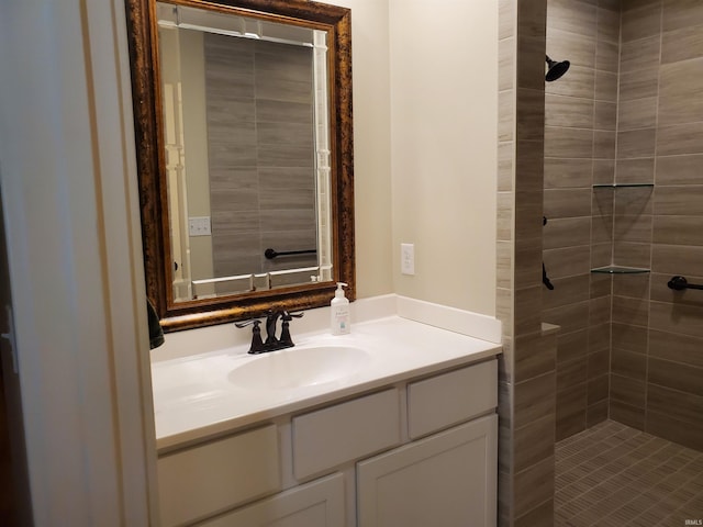 bathroom featuring vanity and a tile shower