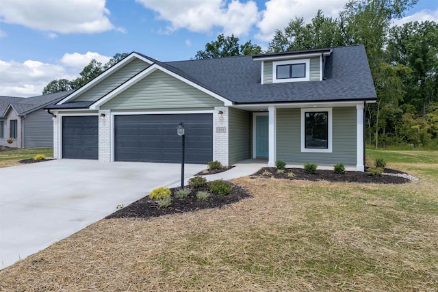 view of front of home featuring a garage, a porch, and a front yard