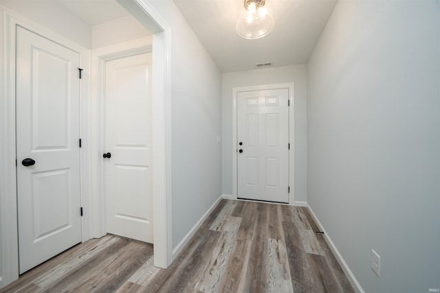 doorway to outside with light hardwood / wood-style floors