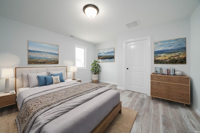 bedroom with light hardwood / wood-style floors