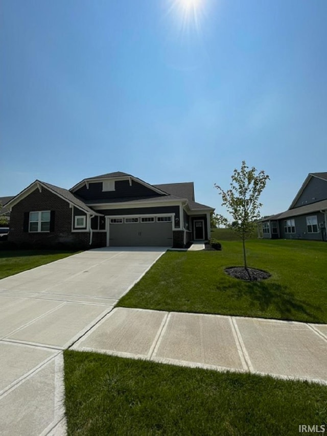 view of front of property with a garage and a front yard