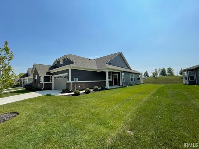 view of side of property with a yard and a garage