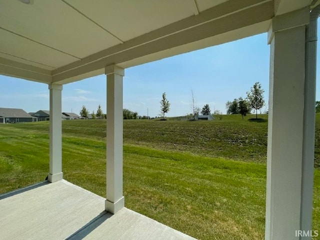 view of yard with a rural view