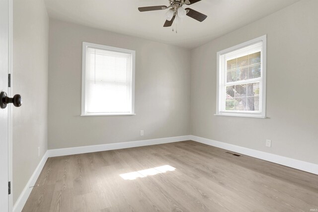 unfurnished room with ceiling fan and light hardwood / wood-style floors