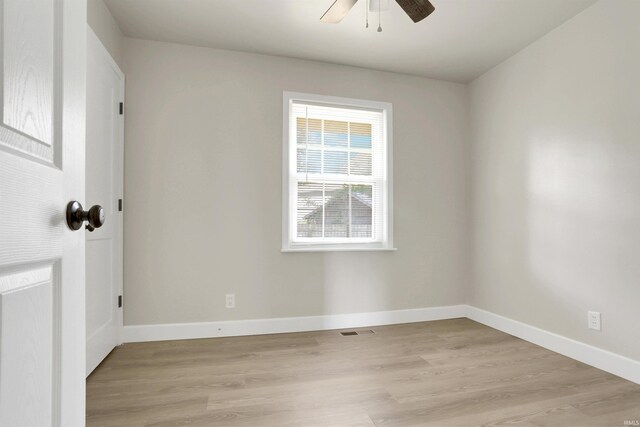 spare room with ceiling fan and light hardwood / wood-style floors