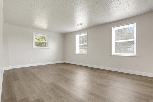 empty room featuring hardwood / wood-style flooring