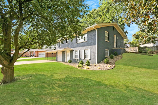 view of front of property with a garage and a front lawn