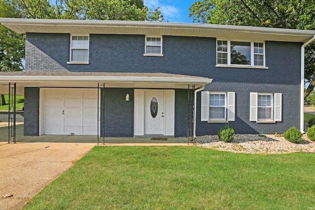 view of front property featuring a front yard and a garage