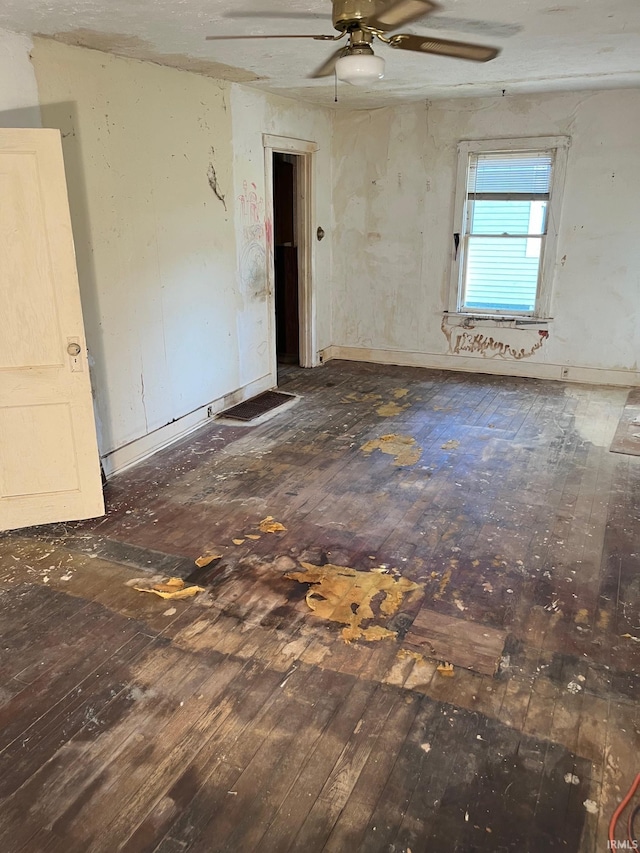 unfurnished room featuring ceiling fan and wood-type flooring