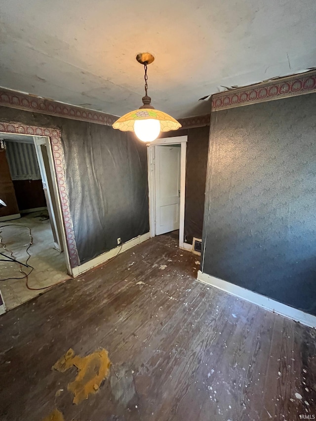 unfurnished room with dark wood-type flooring