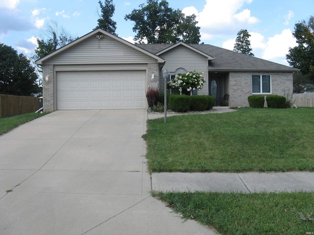 ranch-style home with a garage and a front lawn