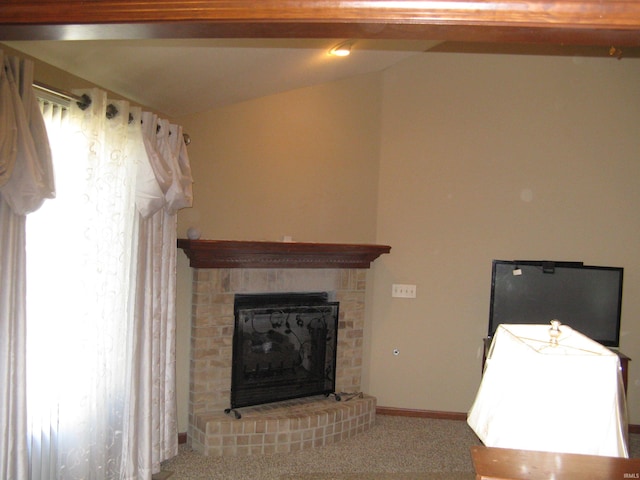 unfurnished living room with carpet flooring, lofted ceiling with beams, and a brick fireplace