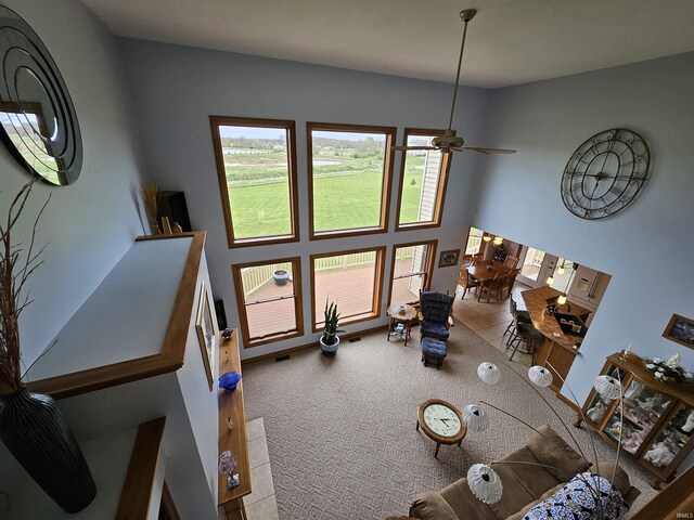 dining area with a textured ceiling, a tile fireplace, an inviting chandelier, and carpet