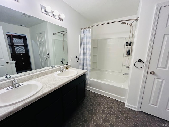 bathroom featuring vanity and shower / tub combo