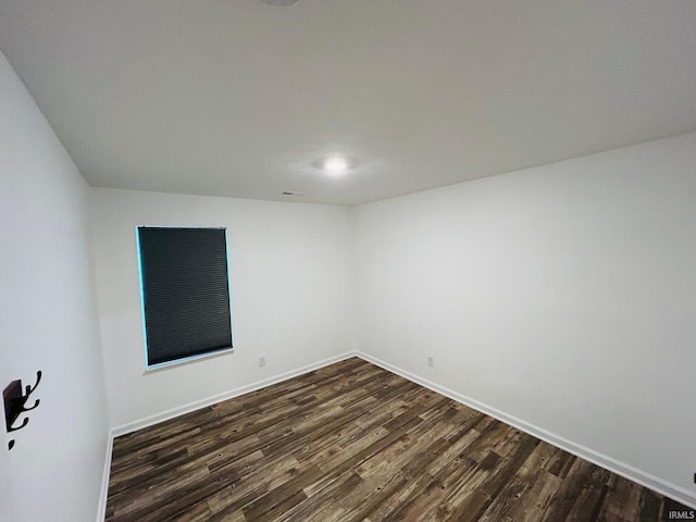 spare room featuring dark hardwood / wood-style floors