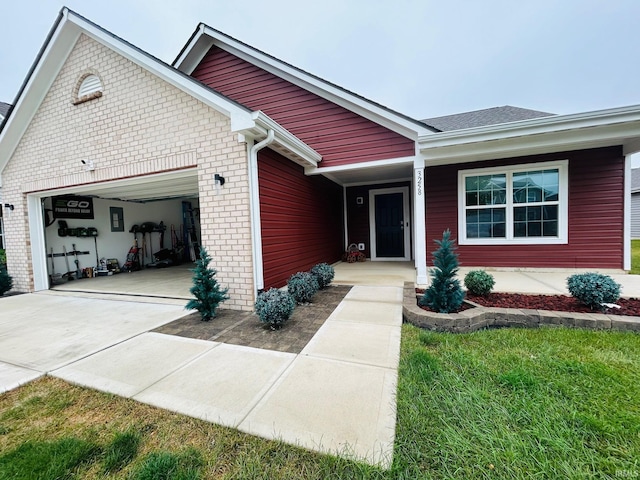 view of front of home with a garage and a front lawn